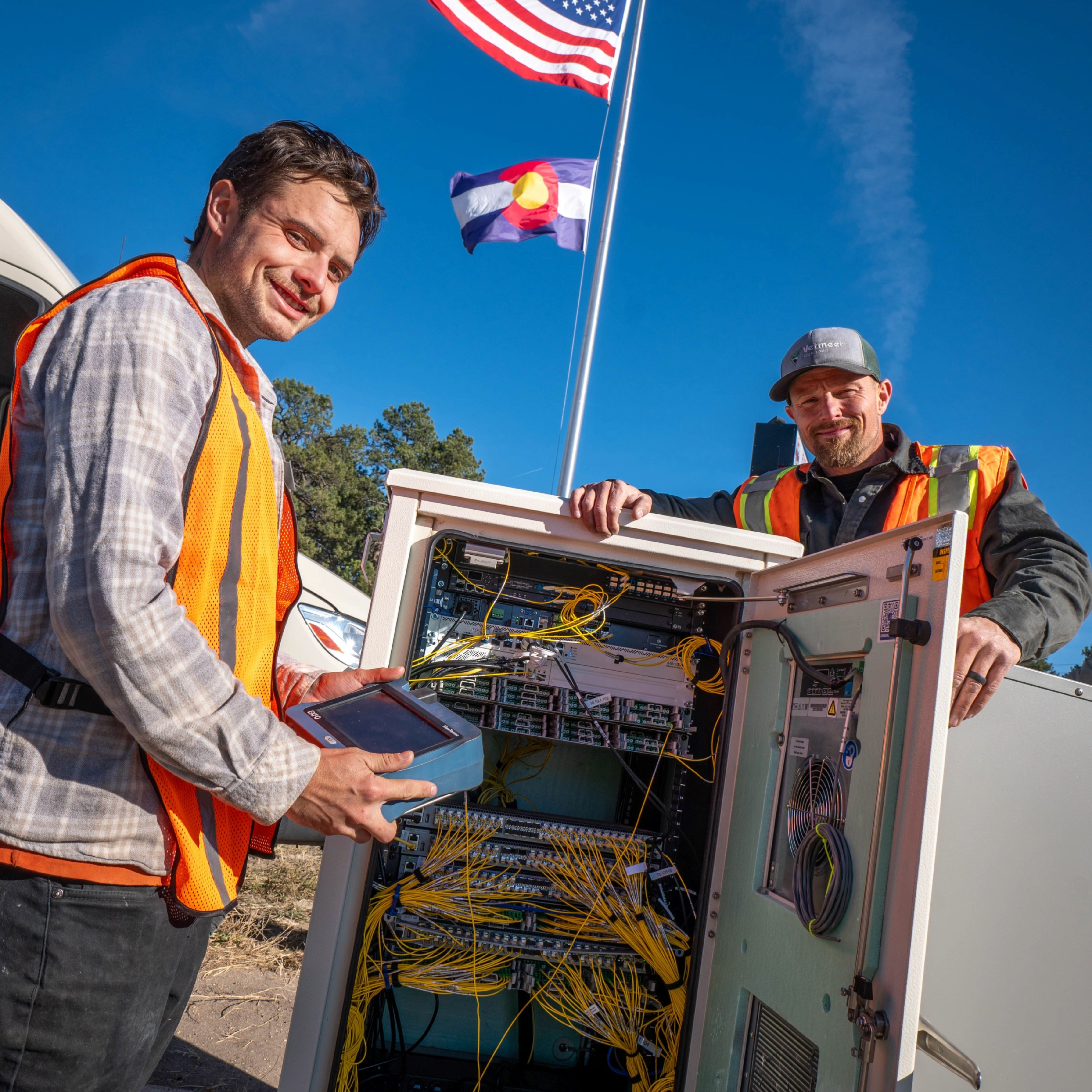 Men working in a broadband connections box