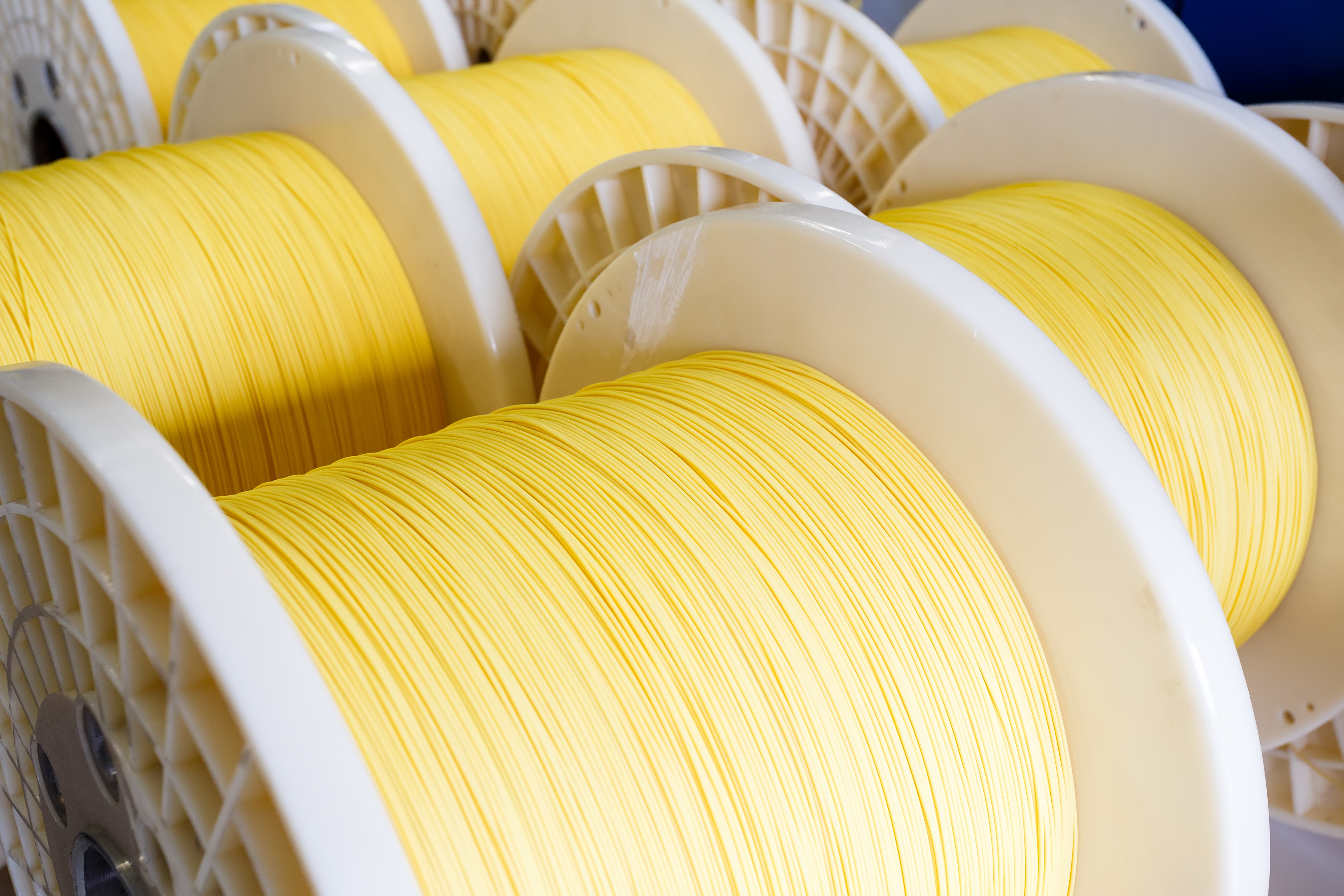 Rolls of yellow broadband fiber
